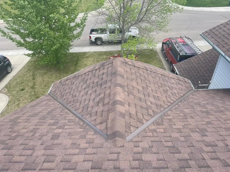 Peakline Roofing & Exteriors professional asphalt shingle roof installation on Calgary residential home with architectural shingles