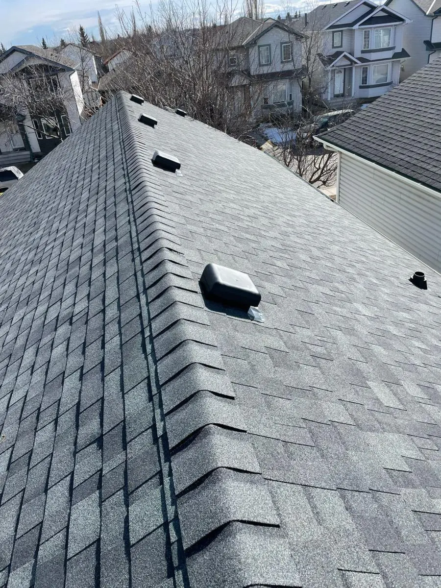 Emergency storm damage roof replacement by Peakline Roofing & Exteriors after Calgary hailstorm with insurance claim assistance