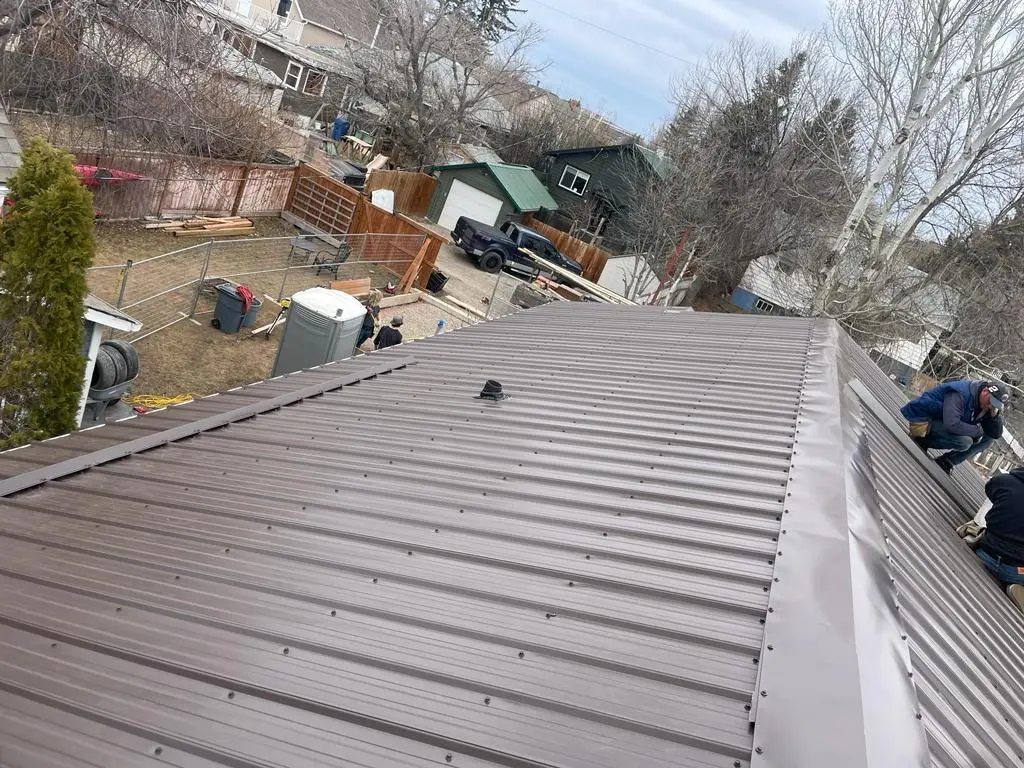 Complete residential roofing project by Peakline Roofing & Exteriors including full tear-off and new shingle installation in Calgary