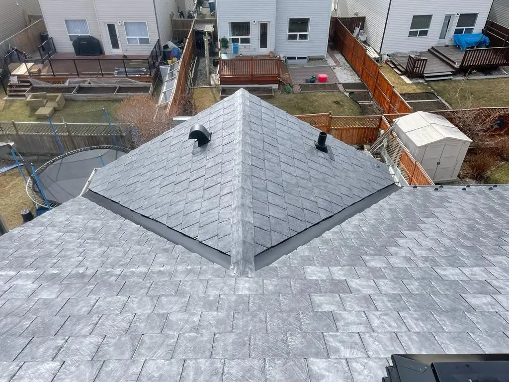 Architectural shingle roof replacement by Peakline Roofing & Exteriors with enhanced curb appeal for Calgary home