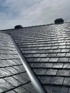 Complete roofing solution by Peakline Roofing & Exteriors including roof replacement, ventilation, and gutter installation in Calgary