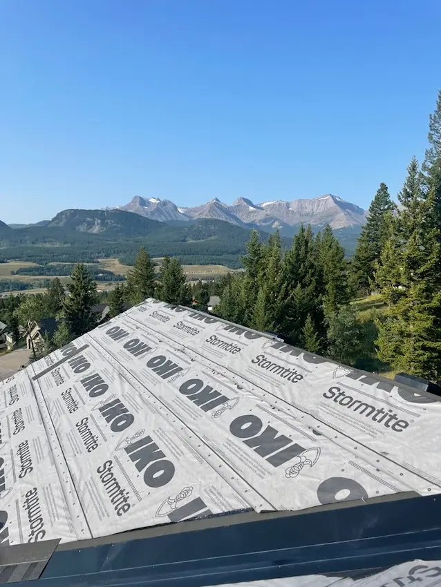IKO Cambridge architectural shingle roof installation by Peakline Roofing & Exteriors with enhanced wind resistance in Calgary