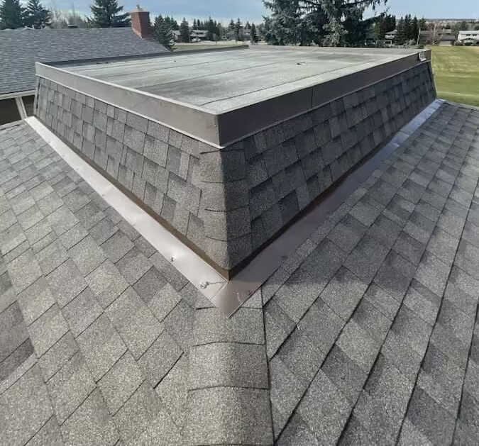 Calgary asphalt shingle roof with metal cap flashing - professional roof inspection by Peakline Roofing