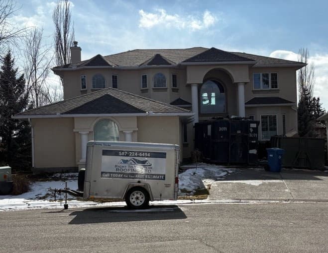 Peakline Roofing & Exteriors professional service trailer at a Calgary luxury home
