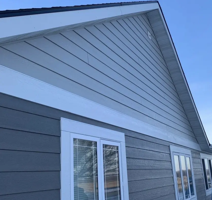 Completed vinyl siding installation project by Peakline Roofing & Exteriors showcasing finished results in Calgary