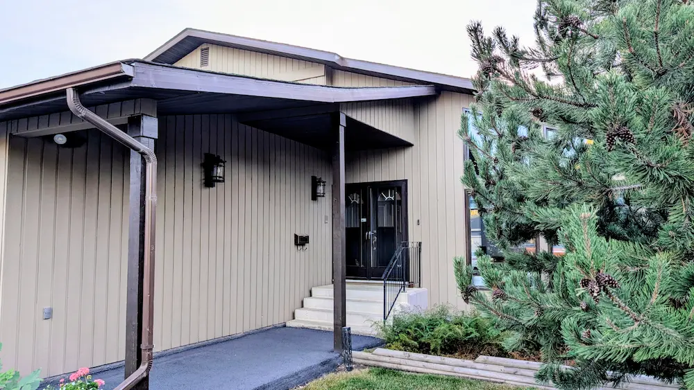 Premium Douglas Fir Siding Install by Peakline Roofing & Exteriors showcasing natural wood character and professional workmanship in Calgary