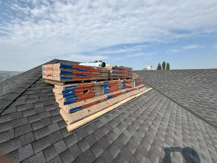 Expert roof repair service by Peakline Roofing & Exteriors addressing storm damage and leak prevention in Calgary residential area